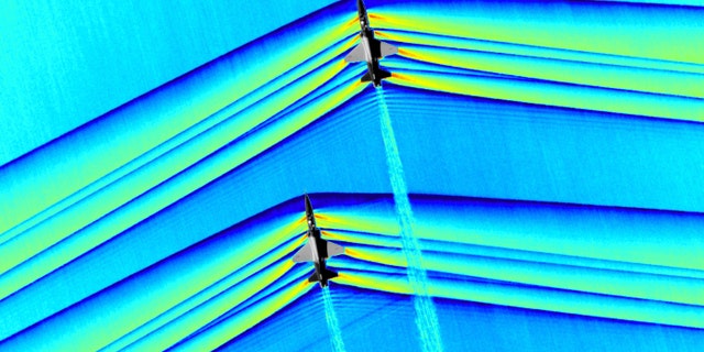 When aircraft fly faster than the speed of sound, shock waves travel away from the vehicle, and are heard on the ground as a sonic boom. (NASA Photo)