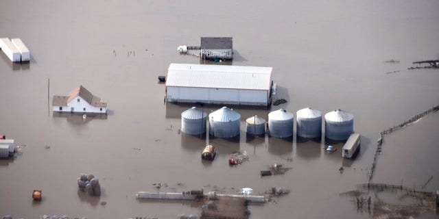 This Monday, March 18, 2019 photo taken by the South Dakota Civil Air Patrol and provided by the Iowa Department of Homeland Security and Emergency Management, shows flooding along the Missouri River in rural Iowa north of Omaha, Neb.