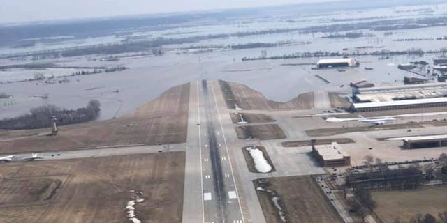 The runway at Offutt Air Force Base can be seen covered by floodwaters from the Missouri River.