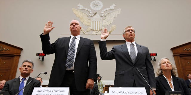 Solyndra CEO Brian Harrison. left, and Chief Financial Officer Bill Stover, right, testified to House lawmakers in September 2011. Attorneys Walter Brown is at left, and Jan. Nielsen Little is at right in this photo. (AP Photo/J. Scott Applewhite, File)