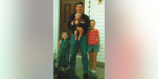 Johnny "Mike" Spann with his three children