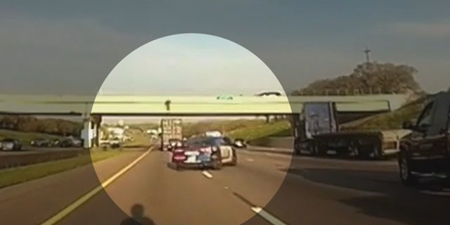 A police officer in Texas directed a semi-truck to under an overpass on Interstate 20 where a teenager was threatening to jump.