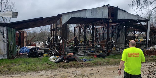 Authorities warned that the death toll could rise further as search efforts continued in the small community of Beauregard and surrounding areas in Lee County, Alabama. (Steven MacLeroy)