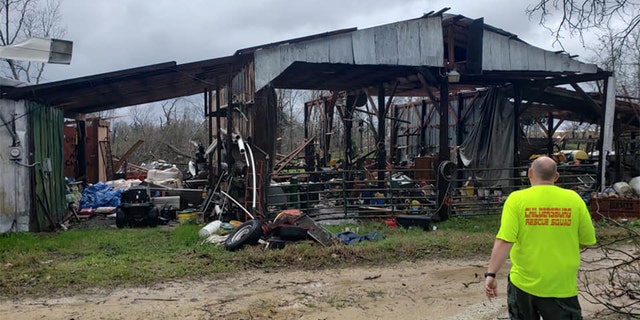 Authorities warned that the death toll could rise further as search efforts continued in the small community of Beauregard and surrounding areas in Lee County, Alabama. (Steven MacLeroy)