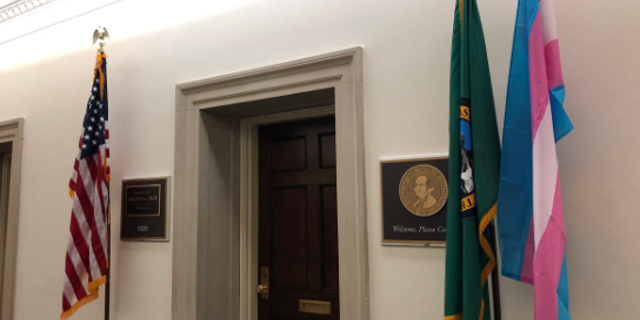 A transgender pride flag, displayed in front of Democratic Rep. Kim Schrier’s office.