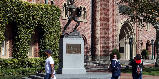 The University of Southern California said in a statement it has placed holds on the accounts of those students, which prevents them from registering for classes or acquiring transcripts while their cases are under review.