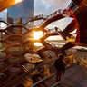 People stand on the Vessel at Hudson Yards a staircase sculpture designed by Thomas Heatherwick at sunset in New York City, March 18, 2019. 