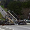 A fallen cell tower lies across U.S. Route 280 highway in Lee County, Ala., in the Smiths Station community after what appeared to be a tornado struck in the area March 3. Severe storms destroyed mobile homes, snapped trees and left a trail of destruction amid weather warnings extending into Georgia, Florida and South Carolina, authorities said. 