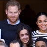 Britain's Prince Harry and Meghan, Duchess of Sussex, pose with students and teachers during their visit to a cooking school at the Villa des Ambassadors in Rabat, Morocco, Feb. 25, 2019. 