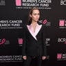 Miley Cyrus looks chic in a black and pink pantsuit while posing on the red carpet for the WCRF's "An Unforgettable Evening" event at the Beverly Wilshire Four Seasons Hotel on February 28, 2019 in Beverly Hills, Calif.