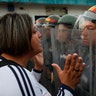 A demonstrator confronts a member of the Bolivarian National Guard in Urena, Venezuela, near the border with Colombia, Feb. 23, 2019. 