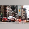 A vintage TWA Lockheed Constellation airplane is transported along 6th Avenue on its way to Times Square in New York City, March 23, 2019.