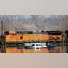 Cars sit in floodwaters from the Platte River alongside a BNSF train, in Plattsmouth, Neb., Sunday, March 17, 2019. 