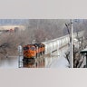 A BNSF train sits in floodwaters from the Platte River, in Plattsmouth, Neb., Sunday, March 17, 2019. Hundreds of people remained out of their homes in Nebraska, but rivers there were starting to recede. The National Weather Service said the Elkhorn River remained at major flood stage but was dropping. (AP Photo/Nati Harnik)
