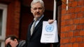 FILE - In this Friday, Feb. 5, 2016 file photo, WikiLeaks founder Julian Assange stands on the balcony of the Ecuadorean Embassy to address waiting supporters and media in London. Police in London arrested WikiLeaks founder Assange at the Ecuadorean embassy Thursday, April 11, 2019 for failing to surrender to the court in 2012, shortly after the South American nation revoked his asylum.