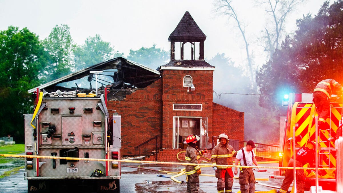 FILE: Firefighters and fire investigators responding to a fire at Mt. Pleasant Baptist Church Thursday, April 4, 2019, in Opelousas, La. 