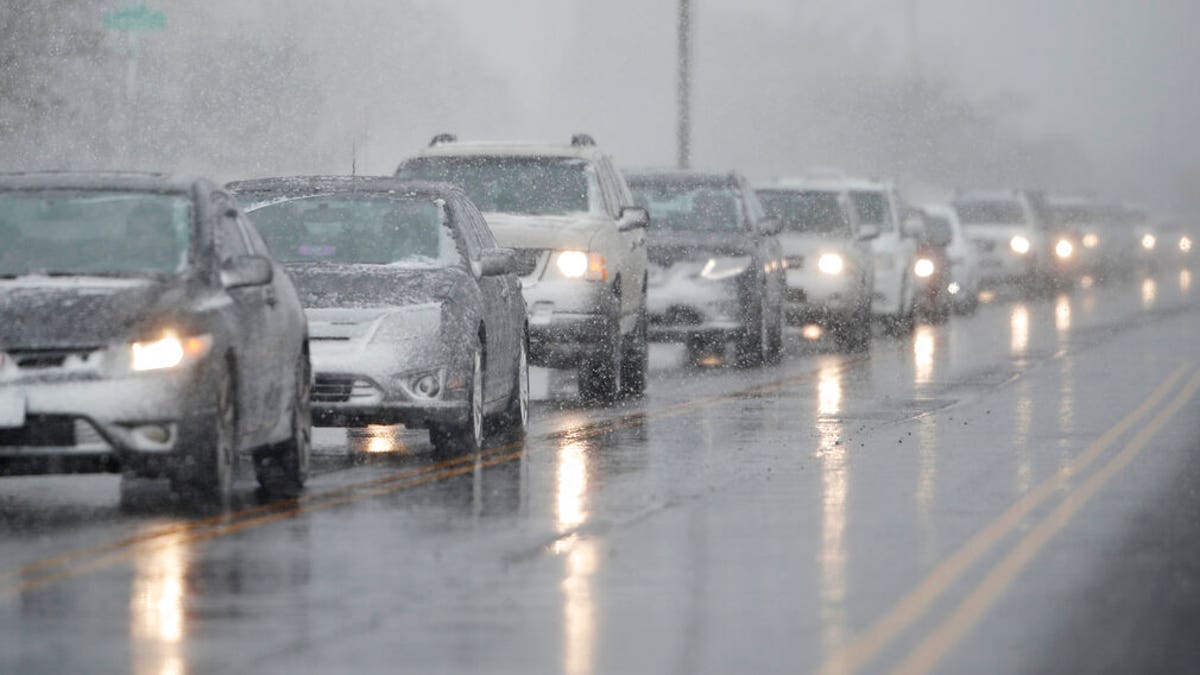Traffic backs up along 56th Avenue as a spring storm rolls in before the evening rush hour Wednesday, April 10, 2019, in Denver. 