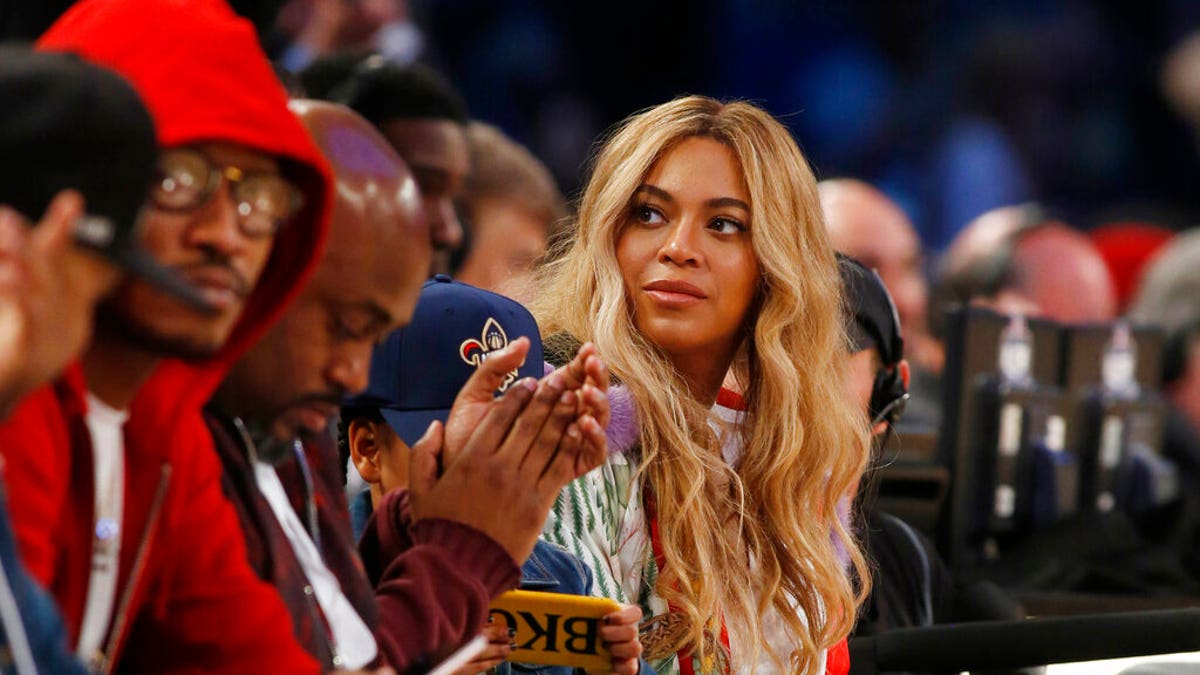FILE: Beyonce sits at court side during the second half of the NBA All-Star basketball game in New Orleans.