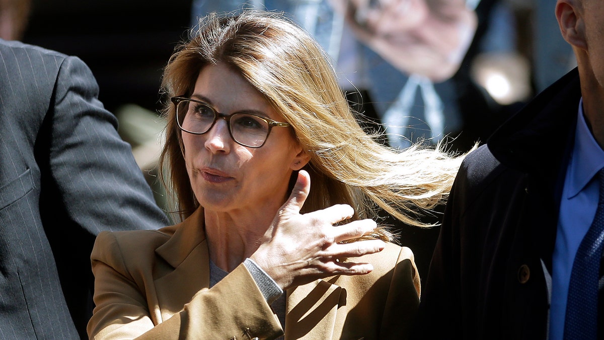 Actress Lori Loughlin arrives at federal court in Boston on Wednesday, April 3, 2019, to face charges in a nationwide college admissions bribery scandal. (AP Photo/Steven Senne)
