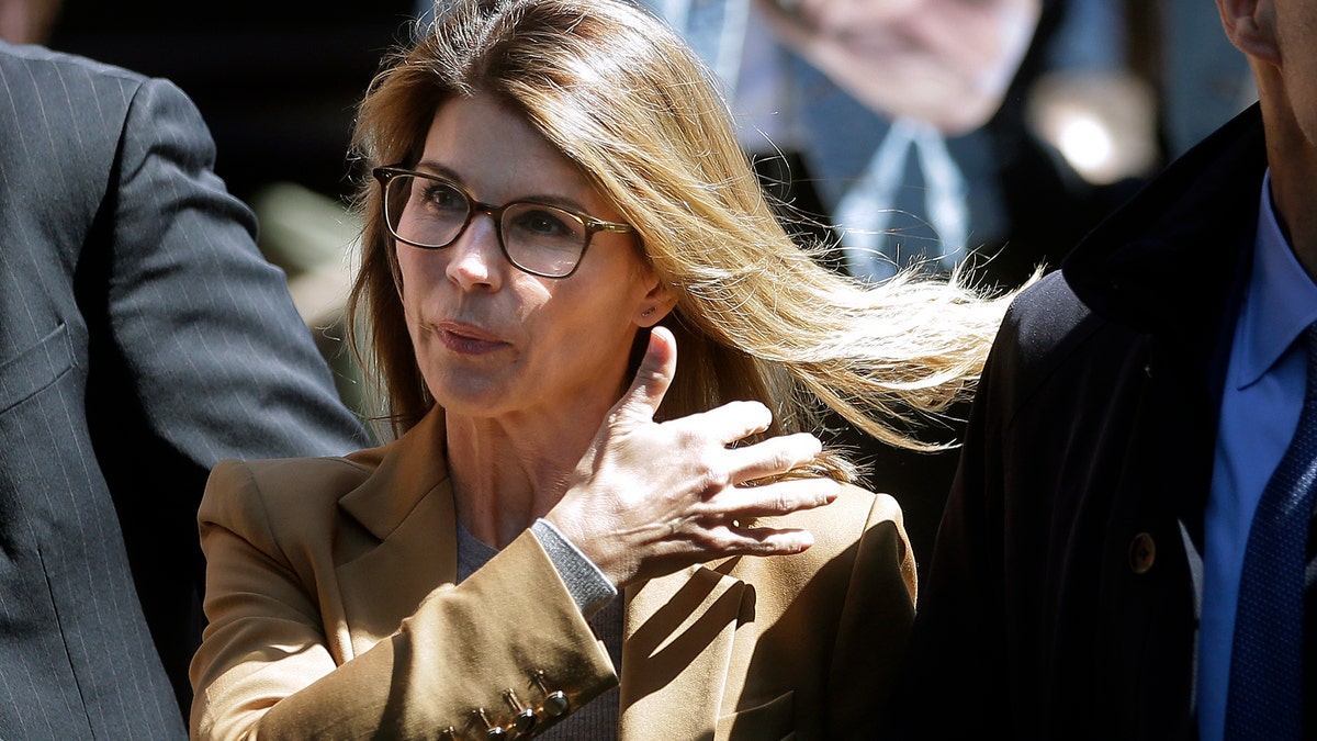 Actress Lori Loughlin arrives at federal court in Boston on Wednesday, April 3, 2019, to face charges in a nationwide college admissions bribery scandal. (AP Photo/Steven Senne)