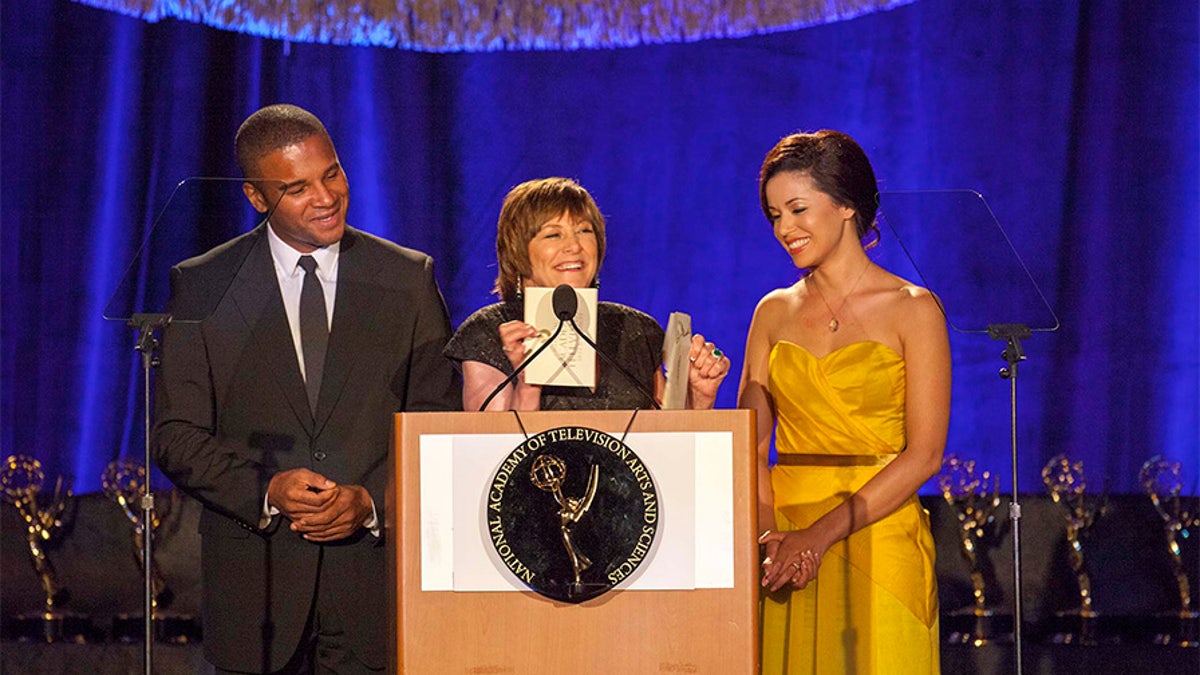 Geri Jewell (center) delivering a speech.