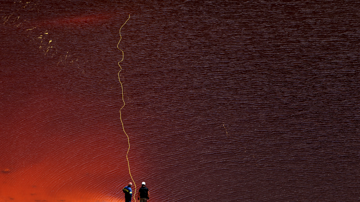 Investigators searching for bodies with a special camera in a man-made lake near the village of Mitsero outside of the capital Nicosia, Cyprus, Saturday, April 27, 2019. (AP Photo/Petros Karadjias)