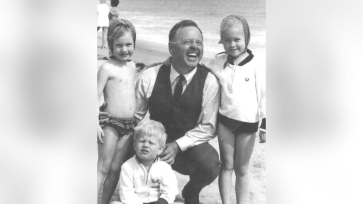 Mickey Rooney with his children at the beach.