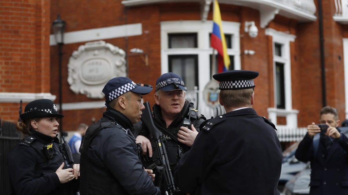 Armed police arrive outside the Ecuadorian Embassy, in London, Friday, April 5, 2019. WikiLeaks founder Julian Assange has been holed up there since 2012. (Associated Press)