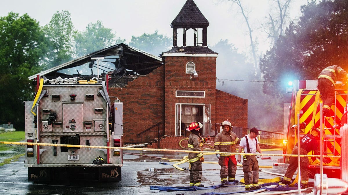 Firefighters and fire investigators respond to a fire at Mt. Pleasant Baptist Church Thursday, April 4, 2019, in Opelousas, La. Authorities in southern Louisiana are investigating a string of "suspicious" fires at three African American churches in recent days. Fire Marshal H. "Butch" Browning said it wasn't clear whether the fires in St. Landry Parish are connected and he declined to get into specifics of what the investigation had yielded so far but described the blazes as "suspicious."