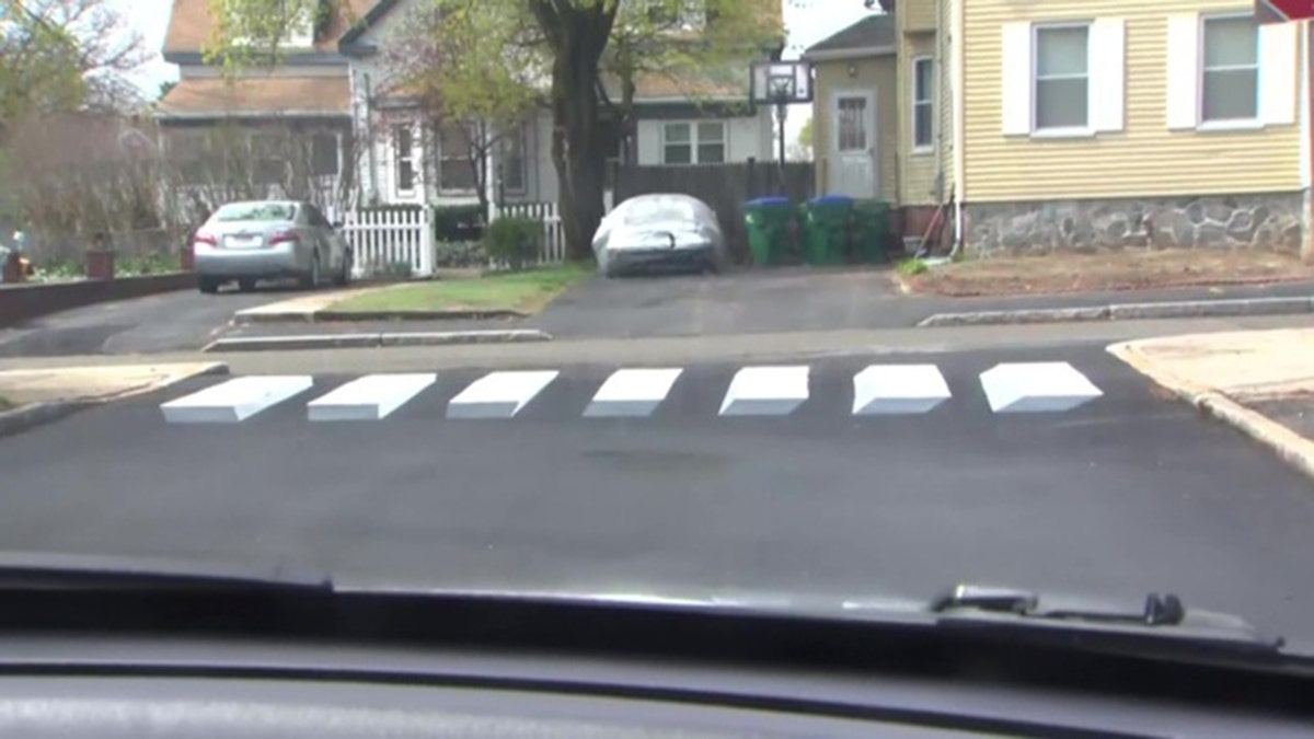 An optical illusion for drivers. The walkway was designed by a pair of fourth graders in Massachusetts. (WBZ / NNS)