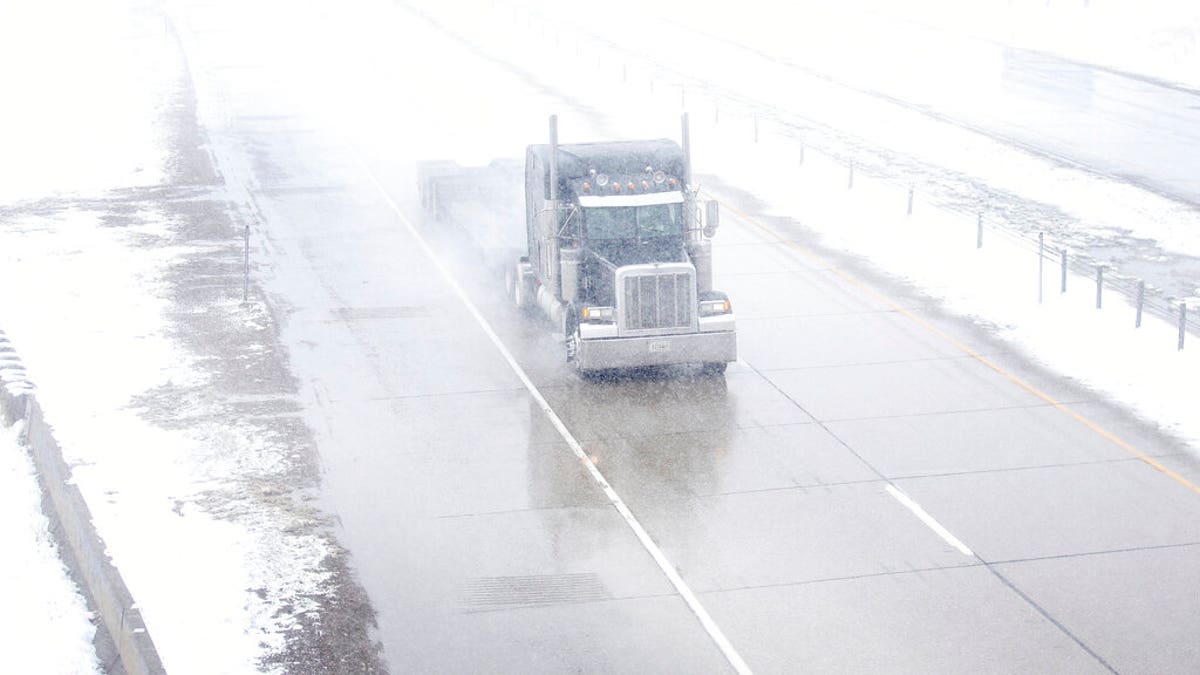 A truck travels east on Interstate 80 during a blizzard warning hitting southeast Wyoming and the Colorado Front Range on Wednesday, April 10, 2019, in Cheyenne. 