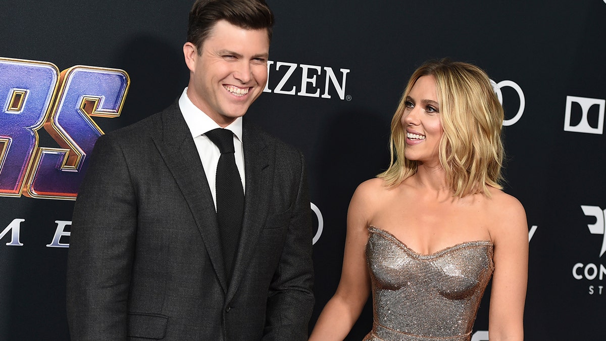 Colin Jost, left, and Scarlett Johansson arrive at the premiere of 
