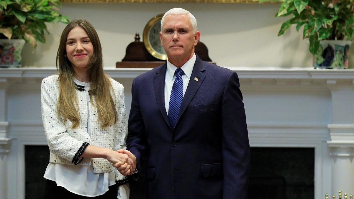 Vice President Mike Pence welcomes Fabiana Rosales, left, wife of Venezuelan opposition leader Juan Guaido, in the Roosevelt Room of the White House in Washington, Tuesday, March 26, 2019. (Associated Press)