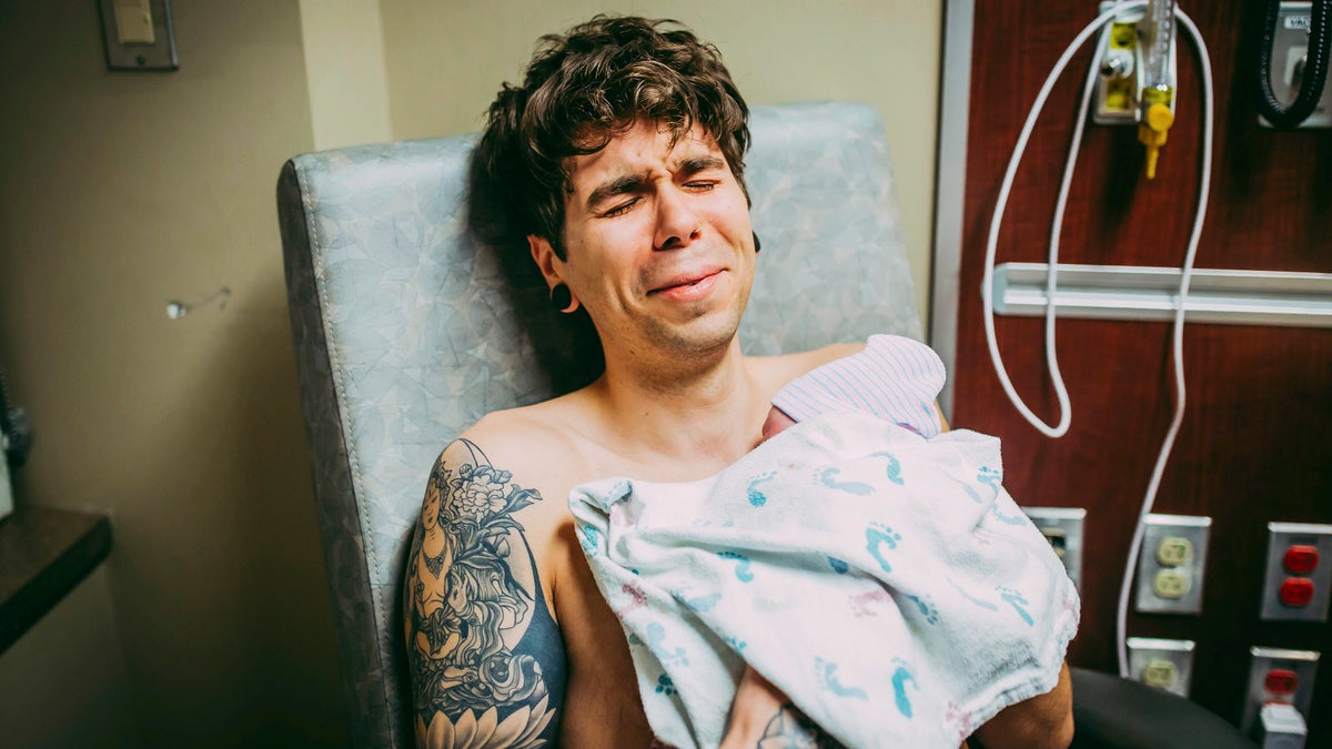 Elliot Dougherty, pictured holding Uma, had spoke to his younger sister about the couple's desire to start a family when she offered to donate her eggs.