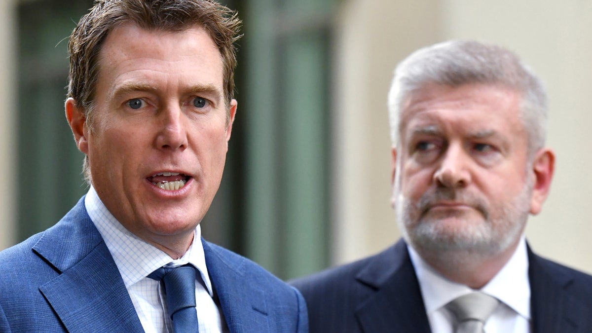 Australia's Attorney-General Christian Porter, left, and Minister for Communications Mitch Fifield hold a press conference at Parliament House, in Canberra, Wednesday, April 4, 2019. (Mick Tsikas/AAP Image via AP)