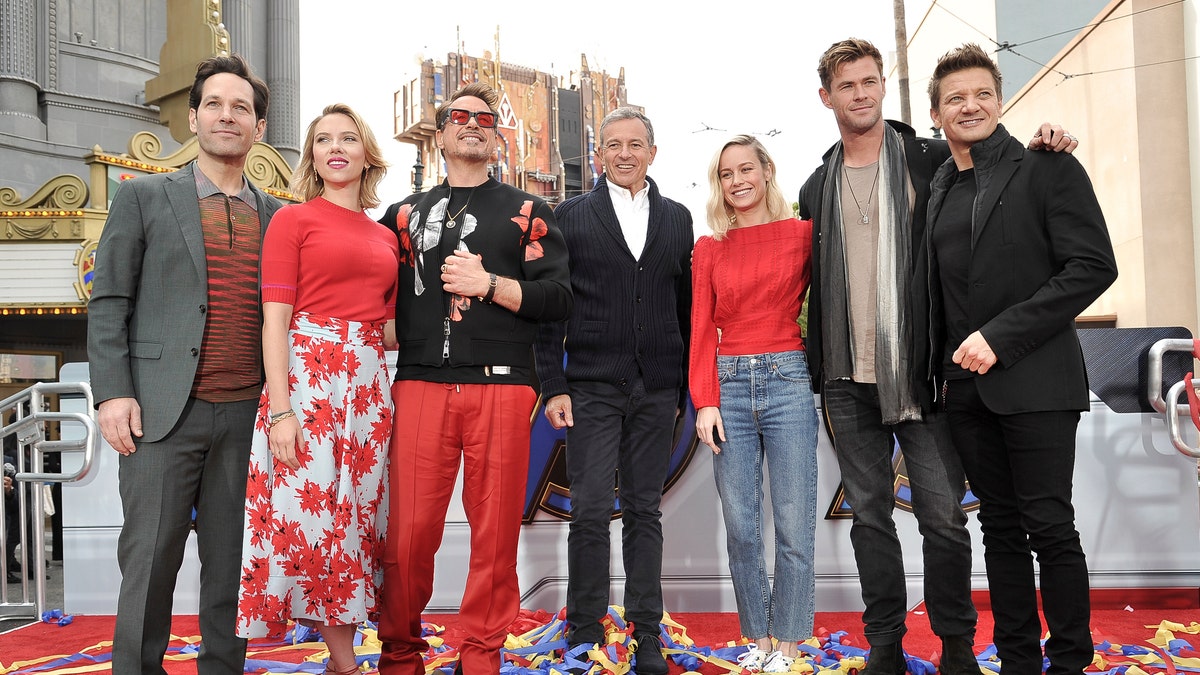 The actors behind the team of superheroes were photographed at the event with Iger.