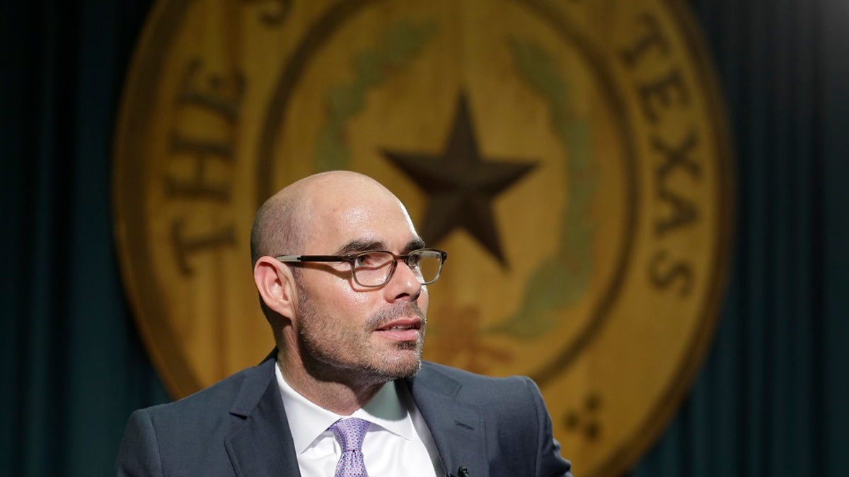Texas Rep. Dennis Bonnen, R-Angleton, talks to the media at the Texas Capitol in Austin, Texas. A Texas gun rights activist drove to the homes of Republican legislators he blamed for stalling proposals to expand gun laws, prompting state troopers to monitor Bonnen's, the now House speaker, family residence. (Associated Press)