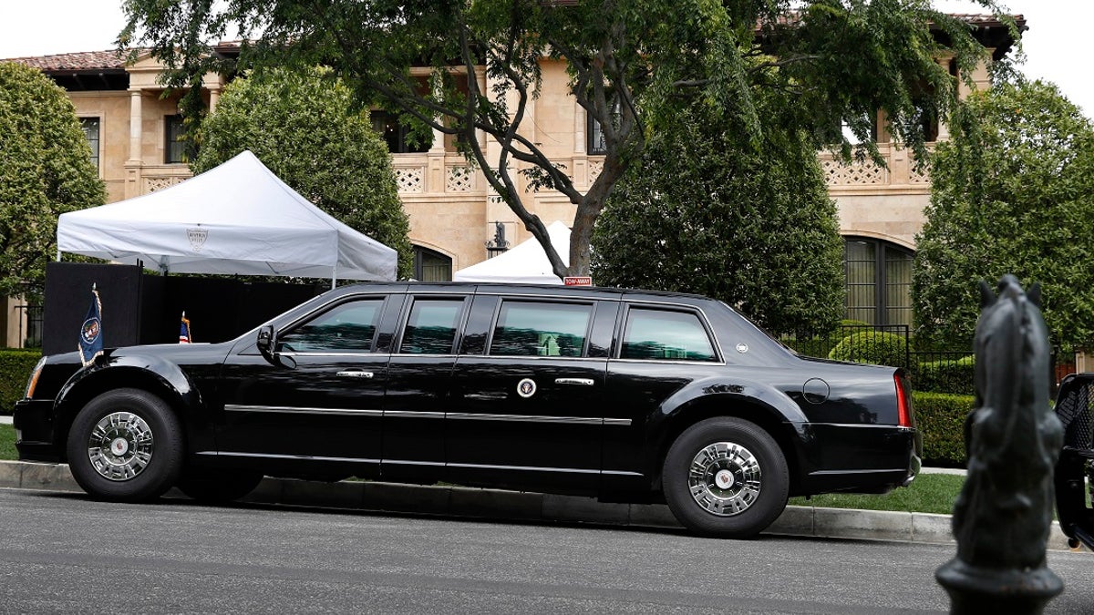 The presidential limo of President Donald Trump is parked on a hill in front of a private residence in Beverly Hills, Calif., as he meets with supporters during a fundraiser, Friday April 5, 2019. (Associated Press)