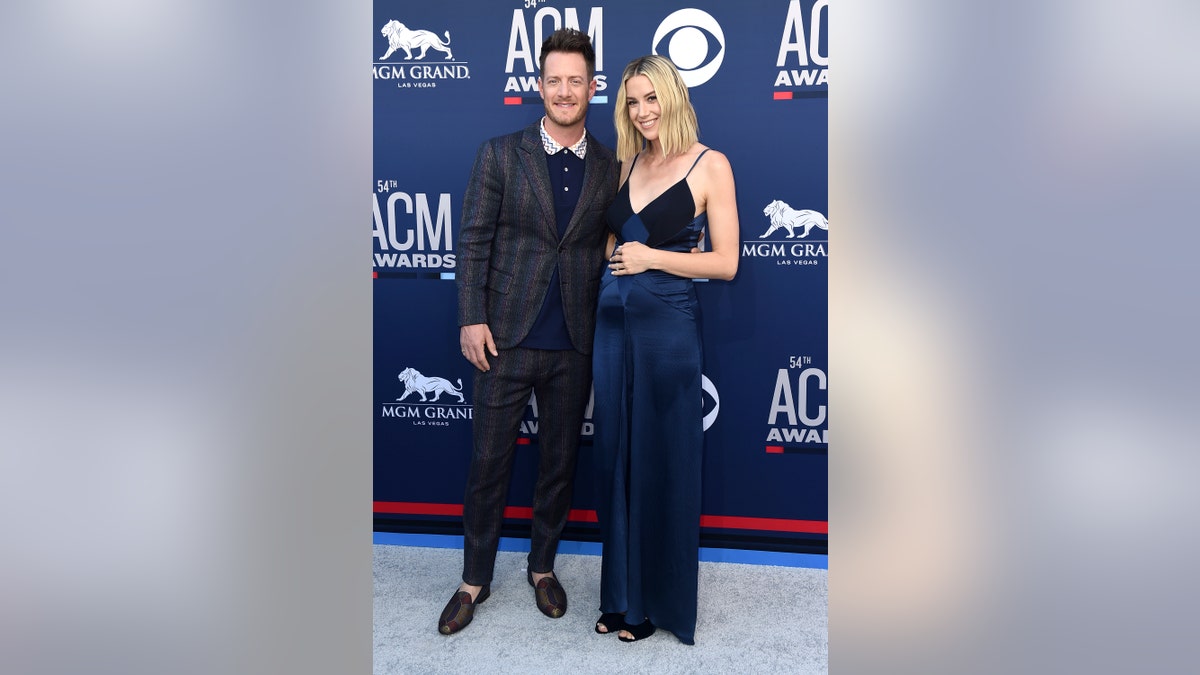 Tyler Hubbard, of Florida Georgia Line, left, and Hayley Stommel arrive at the 54th annual Academy of Country Music Awards at the MGM Grand Garden Arena on Sunday, April 7, 2019, in Las Vegas.