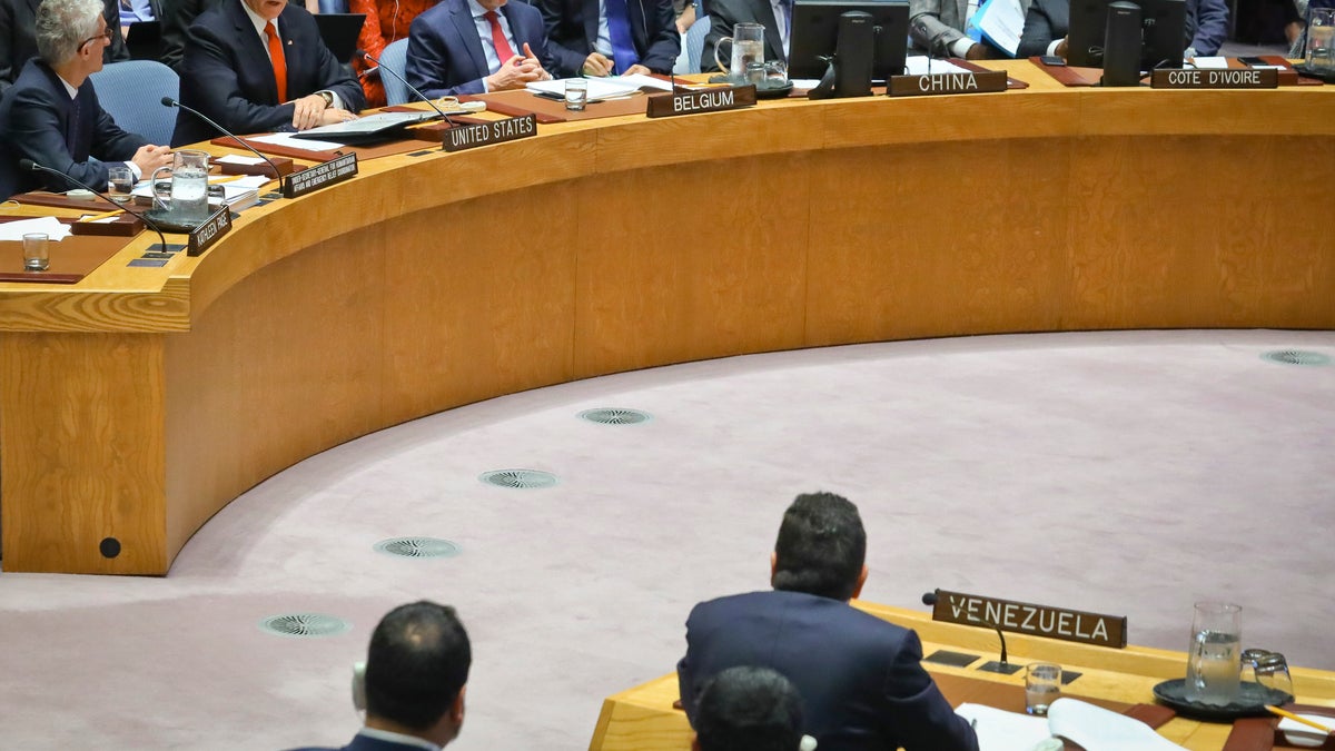 United States Vice President Mike Pence, second from left top, looks at Venezuela United Nations Ambassador Samuel Moncada, bottom right, while addressing him directly during a meeting on Venezuela in the U.N. Security Council, April 10, 2019 at U.N. headquarters. (AP Photo/Bebeto Matthews)