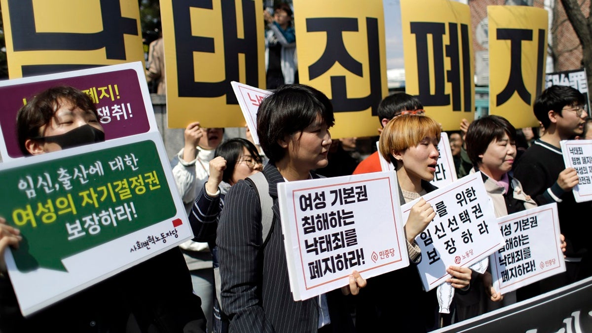 Protesters shout slogans during a rally demanding the abolition of the country's ban on abortions outside of the Constitutional Court in Seoul, South Korea. (AP Photo/Lee Jin-man)