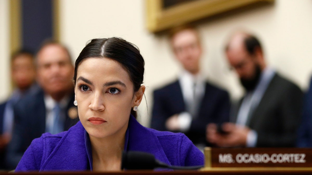 Rep. Alexandria Ocasio-Cortez, D-N.Y., listens during a House Financial Services Committee hearing with leaders of major banks on Capitol Hill in Washington. (AP Photo/Patrick Semansky, File)