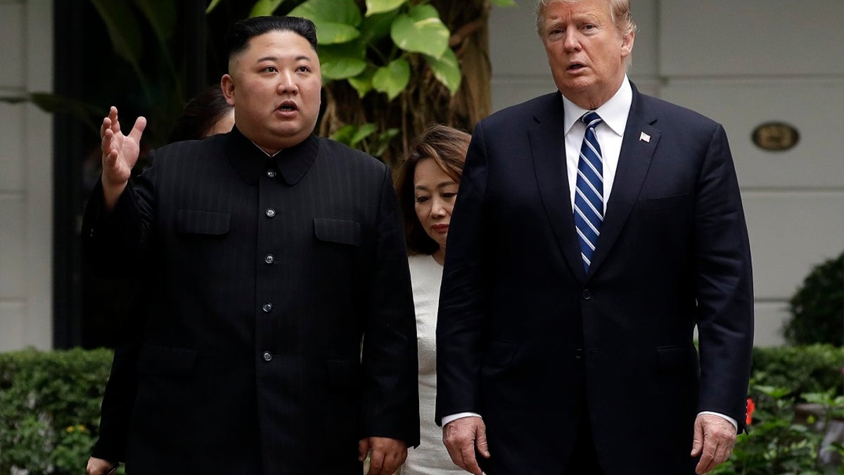 President Donald Trump and North Korean leader Kim Jong Un take a walk after their first meeting at the Sofitel Legend Metropole Hanoi hotel, in Hanoi. Kim says he’s open to having a third summit with Trump if the United States could offer mutually-acceptable terms for an agreement by the end of the year. (AP Photo/Evan Vucci, File)