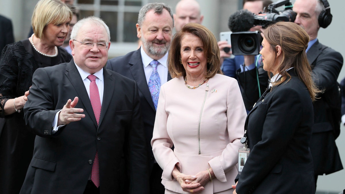 US House of Representatives speaker Nancy Pelosi is greeted by Chairperson of the lower house of parliament Sean O Fearghail, left, on arrival at Leinster House in Dublin to deliver an address in Dublin, Ireland, Wednesday April 17, 2019. (Brian Lawless, via AP)