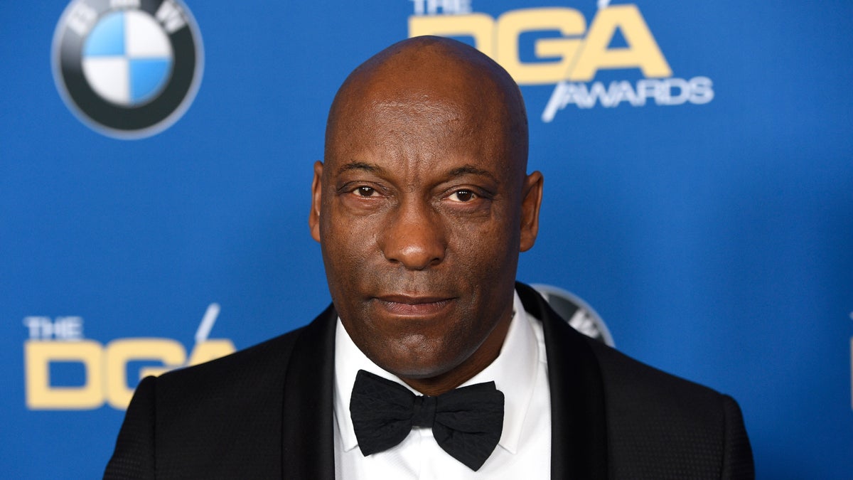 FILE - In this Feb. 3, 2018 file photo, John Singleton arrives at the 70th annual Directors Guild of America Awards in Beverly Hills, Calif. The "Boyz n the Hood" director suffered a stroke last week and remains hospitalized, according to a statement from his family.