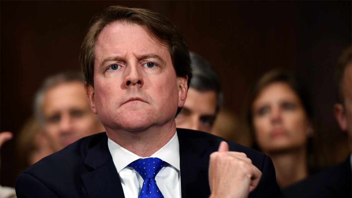 In this Sept. 27, 2018, file photo, White House counsel Don McGahn listens as Supreme court nominee Brett Kavanaugh testifies before the Senate Judiciary Committee on Capitol Hill in Washington. A federal appeals court Monday threw out a lawsuit to compel McGahn to testify before the House Judiciary Committee.  (Saul Loeb/Pool Photo via AP, File)