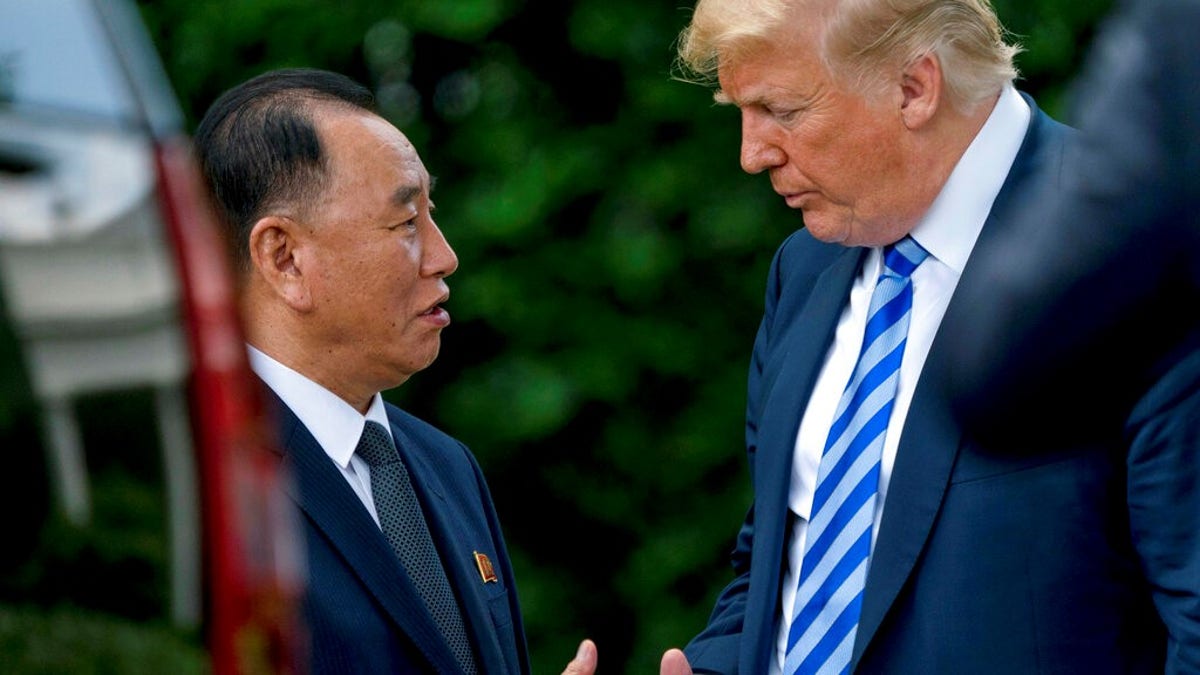 President Donald Trump shakes hands with Kim Yong Chol, former North Korean military intelligence chief and one of leader Kim Jong Un's closest aides.