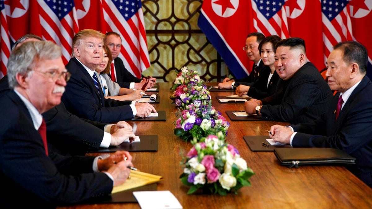 President Donald Trump speaks during a meeting with North Korean leader Kim Jong Un Thursday, Feb. 28, 2019, in Hanoi. At front right is Kim Yong Chol, a North Korean senior ruling party official and former intelligence chief.