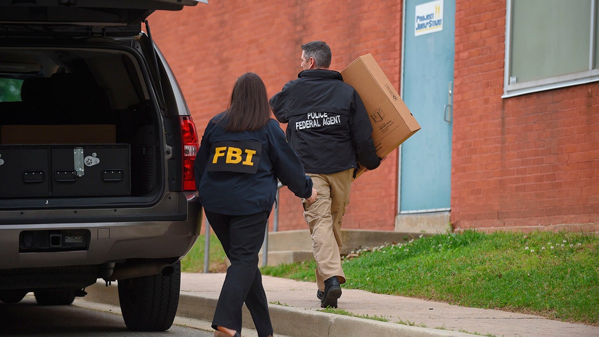 Federal agents arrive at the Maryland Center for Adult Training in Baltimore. MD, Thursday, April 25, 2019. Agents with the FBI and IRS are gathering evidence inside the two homes of Baltimore Mayor Catherine Pugh and in City Hall, as well as the office of her lawyer and the home of a top aide.