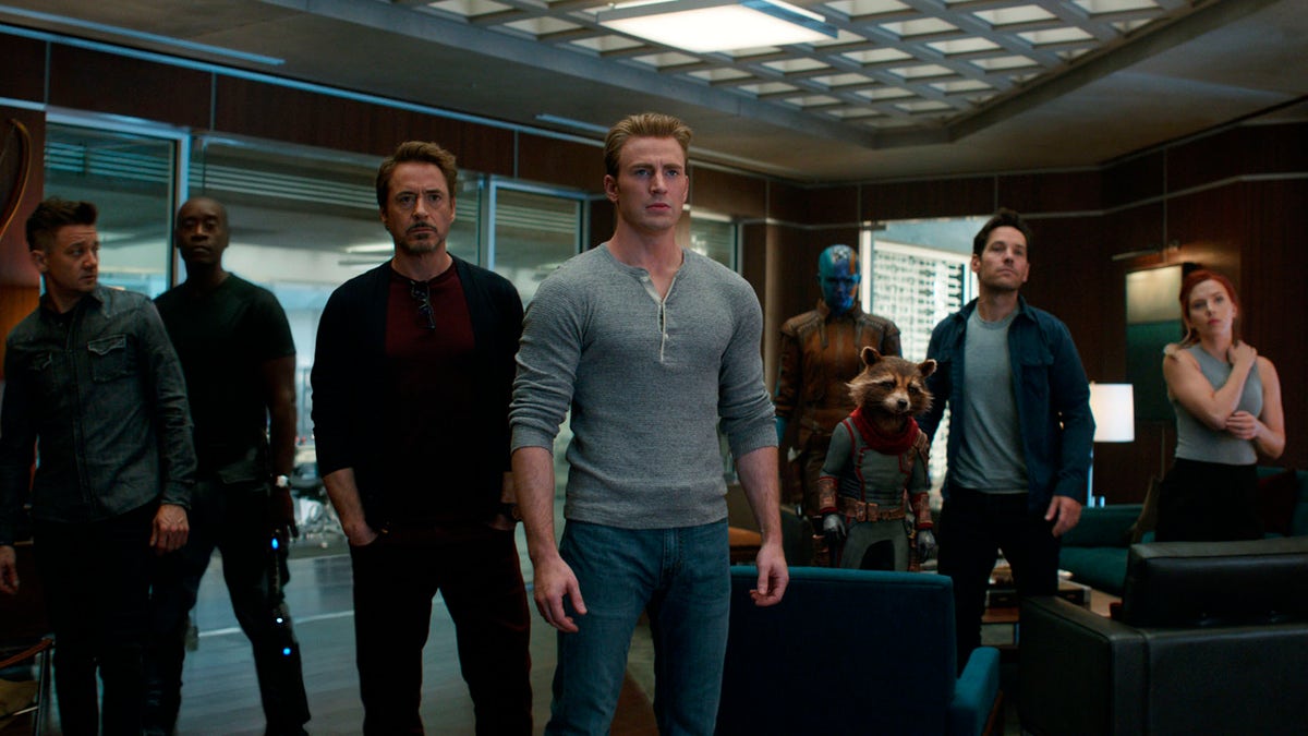 This image released by Disney shows, from left, Jeremy Renner, Don Cheadle, Robert Downey Jr., Chris Evans, Karen Gillan, the character Rocket, voiced by Bradley Cooper, Paul Rudd and Scarlett Johansson in a scene from “Avengers: Endgame.” (Disney/Marvel Studios via AP)